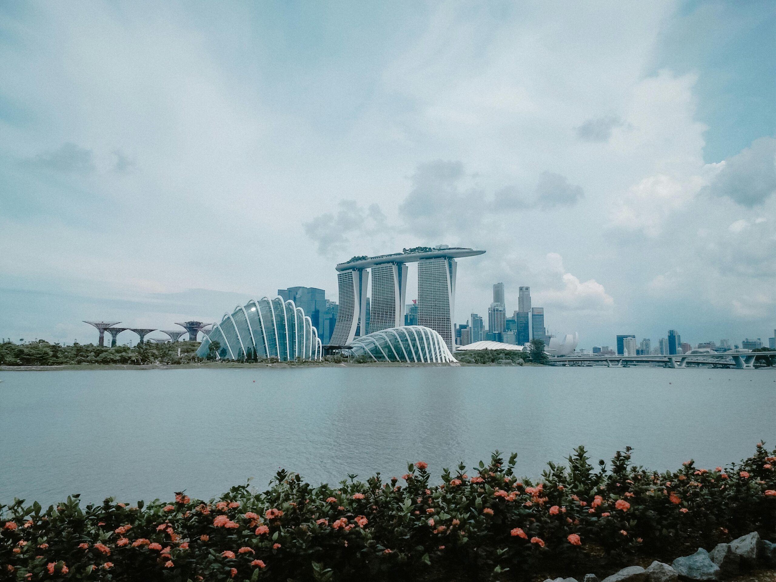 Iconic Marina Bay Sands with city skyline and Gardens by the Bay, Singapore.