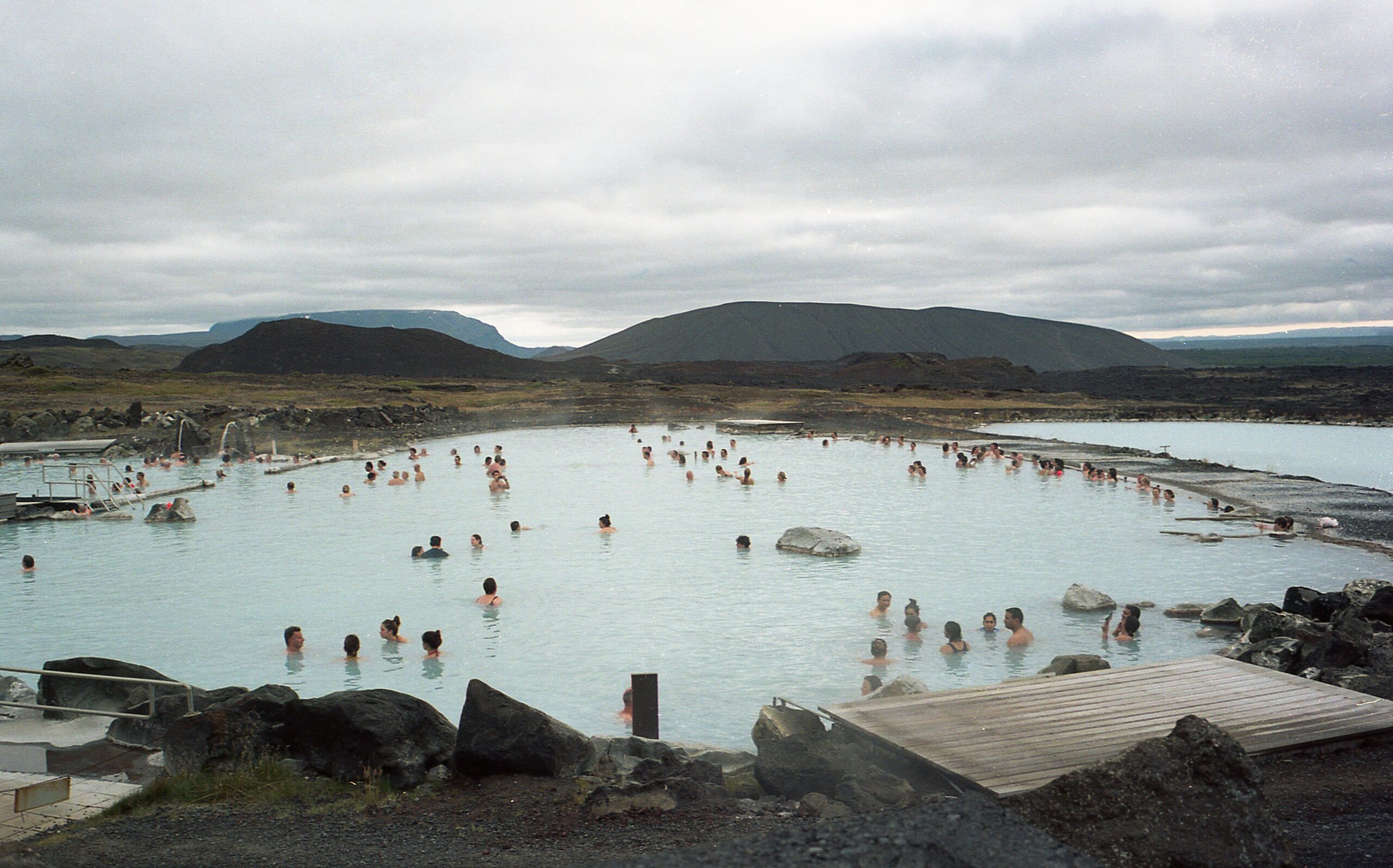 People enjoying relaxation in a natural geothermal spa in Reykjavík, Iceland.